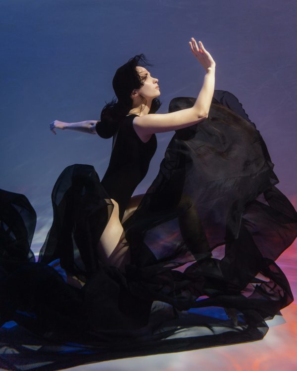 young-woman-flowing-dress-posing-submerged-underwater